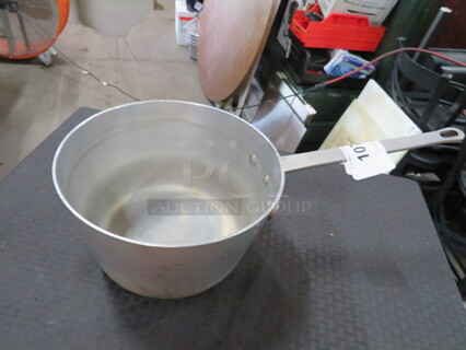 One 9.5 Inch Aluminum Sauce Pan.