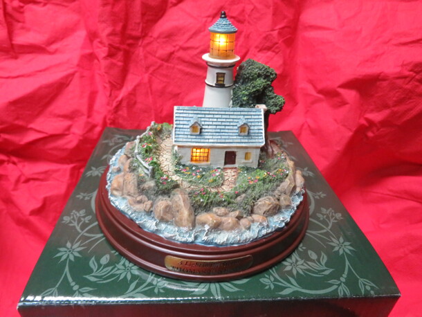 One NEW Thomas Kincade A LIGHT IN THE STORM Lighted Lighthouse. Complete With Certificate Of Authenticity.