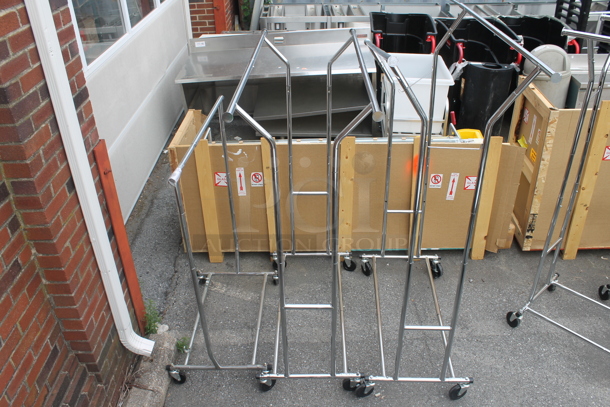 3 Chrome Finish Metal Clothing Racks on Commercial Casters. 50.5x22.5x62.5, 39x22x50. 3 Times Your Bid! - Image 1 of 6