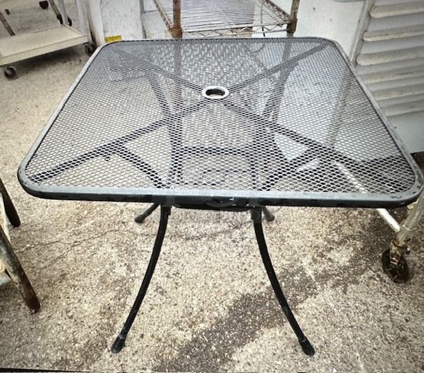 One Black Metal Patio Table With Umbrella Hole. 28X28X28