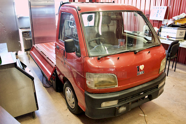 WORK HORSE! 1999/2000 Diahatsu Hijet S210P Pick-Up/Flatbed Truck. 64875Km / 40311 Miles - Runs Perfectly! 5-Speed Manual Transmission, 4 Wheel Drive, 600CC 3 Cylinder, Fuel Injected, Bed Converts From Pick-Up Truck To Flat Bed. Includes Spare Tire. Minor Rust On Flat Bed Panels - Driver side mirror needs to be re-attached. Includes All Original Paperwork. Made In Japan. - Image 10 of 12