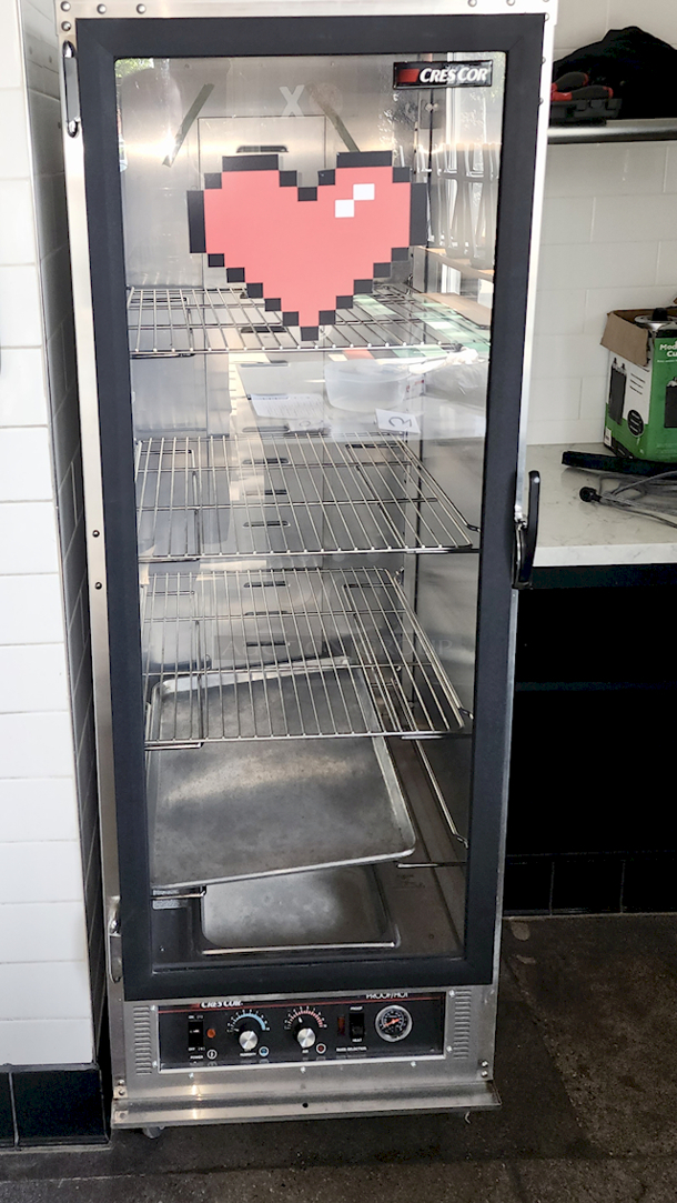 LIKE NEW!! Cres Cor 121-PH-UA-11D Proofing and Holding Cabinet - Non-Insulated, On Commercial Casters. 120 V/60 Hz/1 ph, 5-20 plug Removable Bottom Heater, Wire Universal Slides For 12" X 20" Thru 18" X 26" Pans, On 4-1/2" Centers, Adjustable On 1-1/2", Capacity (11) 18" X 26" Sheet Pans Or (22) 12" X 20" Pans. 241⁄4 in. W x 32 in. D x 693⁄4 in. H *Located In Bakersfield, CA.* *In-Person Pick-up & Shipping Available*
 - Image 1 of 3