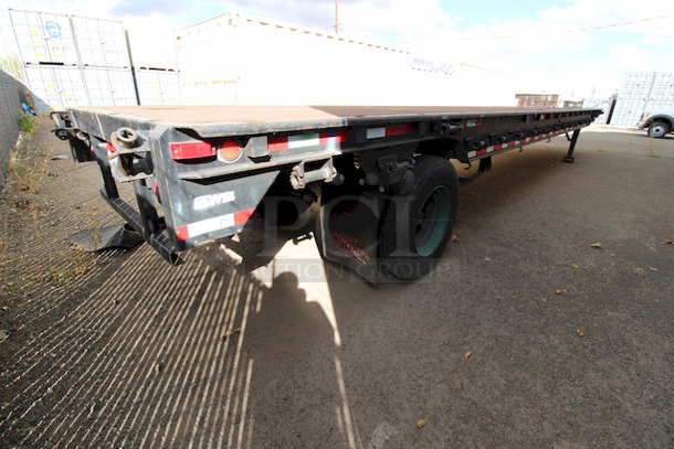 ROAD READY!! 40FT Steel Flatbed Tailer, 4 Wheels. 40FTx96".    VIN# 070F1283; Year 1970; Manufacturer Pike Trailer; Type Flatbed; Steel Construction; Length x Width 40' x 96"; Spring Ride Suspension; Location Single Fixed Axle; Tire Size LP 22.5; Wheel Construction Steel; Wheel Type Budd - Image 5 of 10
