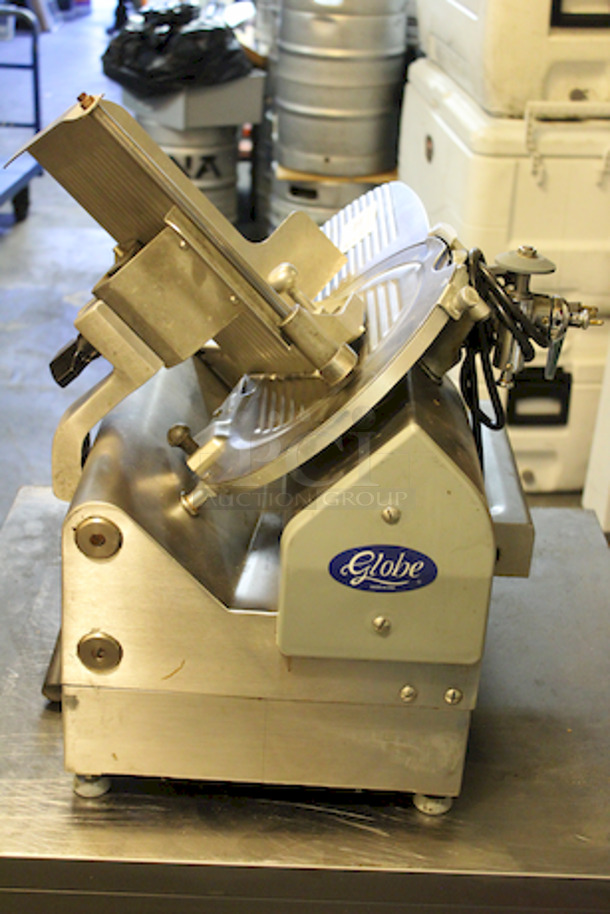 AMAZING! Globe 3850 Electric Food Slicer - Heavy Duty Stainless Steel, Two Speed Automatic, 13" Blade. Full 45° angle gravity feed
Gear driven motor
Top mounted knife sharpener
120V. 1/2 HP. 23x263/4x25. 166 lbs. - Image 4 of 6