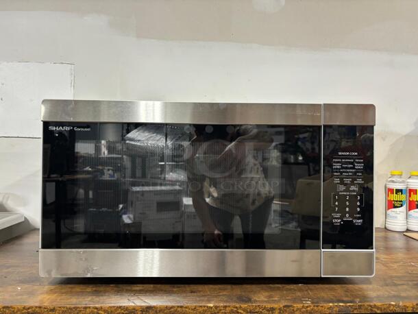 Brand New Scratch & Dent Sharp SMC2266HS
24 Inch Countertop Microwave Oven with 2.2 cu. ft. Capacity, 11 Power Levels, 1200 Watts Cooking Power, Silent Mode, Express Cook, Sensor Cook, Auto Defrost, Kitchen Timer and 12 Inch Removable Glass Turntable - Image 3 of 6