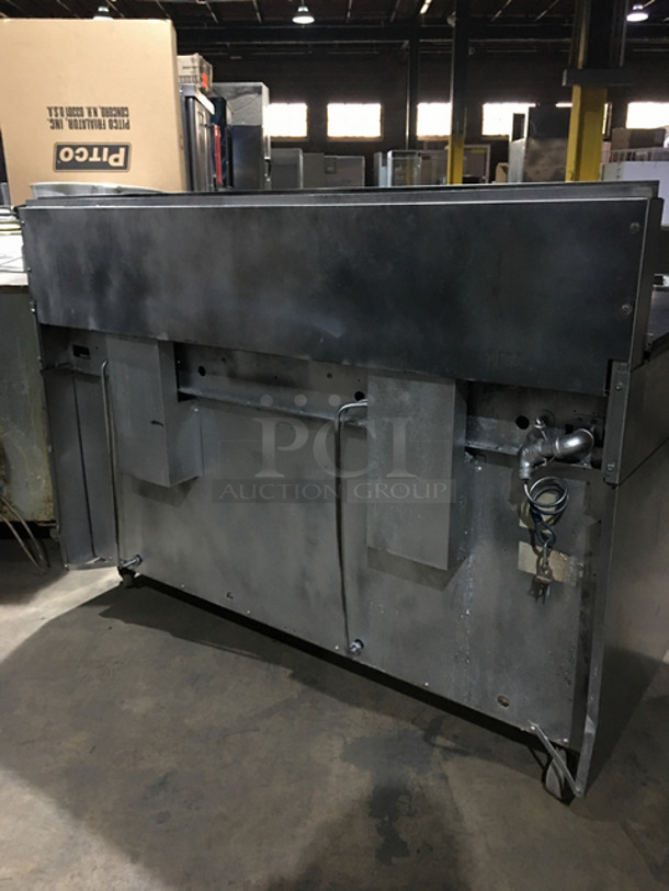 AN ANMAZING FIND! Garland 8 Burner Stove! With Left Side Hot Plate! With Back Splash! With 2 Full Size Ovens Underneath! With Metal Oven Racks! All Stainless Steel! On Casters! - Image 3 of 10