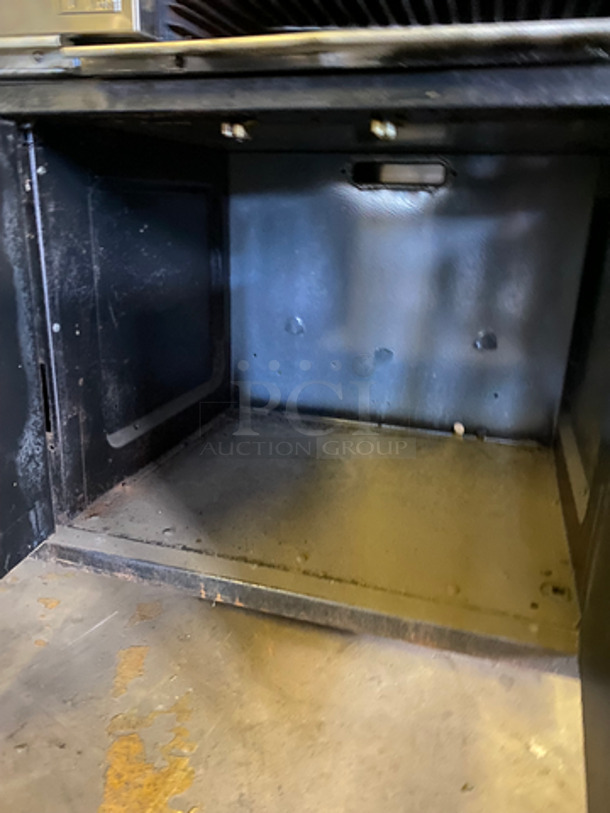 Commercial Natural Gas Powered 4 Burner Stove! With Built In Flat Top Grill! With Back Splash And Salamander Shelf! With Full Size Oven! Metal Oven Rack! With 2 Door Storage Area Underneath! All Stainless Steel! - Image 12 of 12