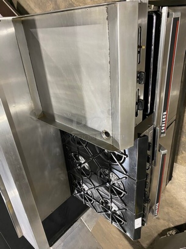 GREAT FIND! Garland Commercial Gas Powered 6 Burner Stove With Right Side Flat Griddle! Griddle Has Side Splashes! With Raised Back Splash And Salamander Shelf! With 2 Oven Underneath! Metal Oven Racks! All Stainless Steel! On Casters! Working When Removed! - Image 5 of 12