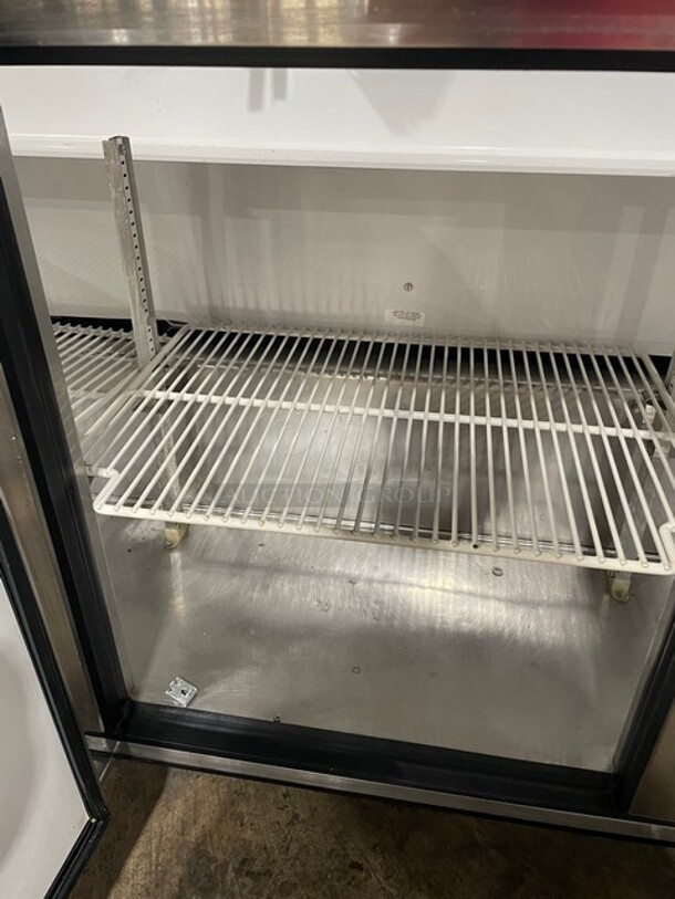 True Mega Top Sandwich/Salad Prep Table! All Stainless Steel! With 3 Door Refrigerated Storage Underneath! With poly Coated Racks! 115V 1 Phase! On Casters! Model: TSSU-72-18 SN: 1-4477571!  - Image 9 of 11
