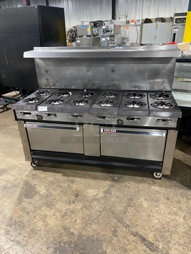 Garland Commercial Natural Gas Powered 12 Burner Stove! With 2 Full-Sized Ovens! With Metal Oven Racks! With Raised Back Splash & Salamander Shelf! Stainless Steel! On Casters! Working When Removed! - Image 1 of 10