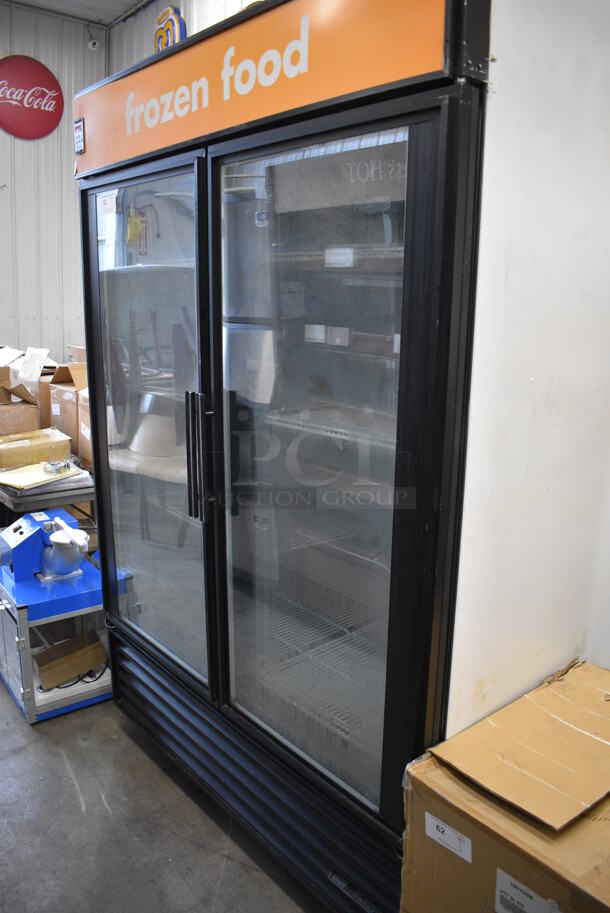 True Model GDM-49F Metal Commercial 2 Door Reach In Freezer Merchandiser w/ Poly Coated Rack on Commercial Casters. 115/208-230 Volts, 1 Phase. 54x32x82