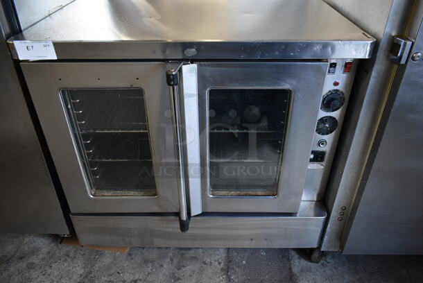 2010 Blodgett SHO-100-E Stainless Steel Commercial Electric Powered Full Size Convection Oven w/ View Through Doors, Metal Oven Racks and Thermostatic Controls. 208-250 Volts. 