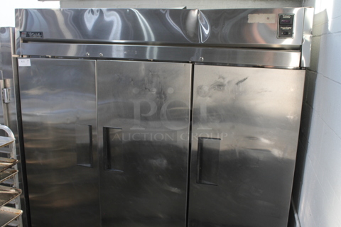 True TA3R-3S Stainless Steel Commercial 3 Door Reach In Cooler on Commercial Casters. 115 Volts, 1 Phase. Tested and Working!