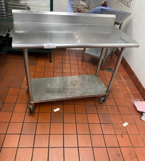 Solid Stainless Steel Work Top/ Prep Table! With Back Splash! With Storage Space Underneath! On Casters! - Image 1 of 6