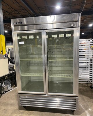 True Stainless Steel 2 Door Glass Display Cooler With Poly Racks On Casters! Model T49G SN:5150370 115V 1PH