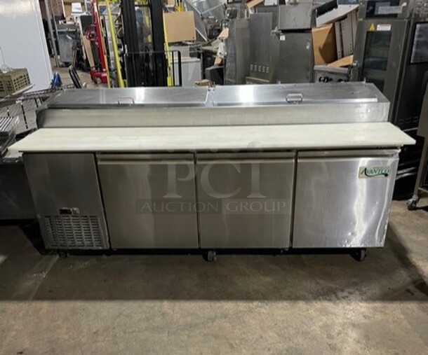 Avantco Commercial Refrigerated Mega Top Pizza Prep Table! With 3 Door Cooler Underneath! All Stainless Steel! With Poly Coated Racks! With Full Sized Cutting Board! On Casters! 115V! Model: 178PICL3HC! Working When Removed! - Image 1 of 10