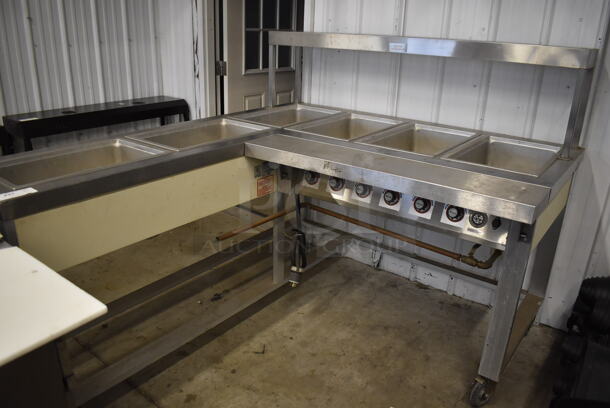 Servolift Eastern 501L-6L Stainless Steel Commercial Electric Powered L Shaped 6 Bay Steam Table on Commercial Casters. 120/208 Volts, 3 Phase. 62x72.5x52