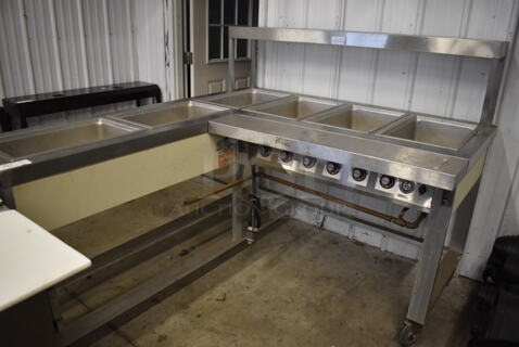 Servolift Eastern 501L-6L Stainless Steel Commercial Electric Powered L Shaped 6 Bay Steam Table on Commercial Casters. 120/208 Volts, 3 Phase. 62x72.5x52