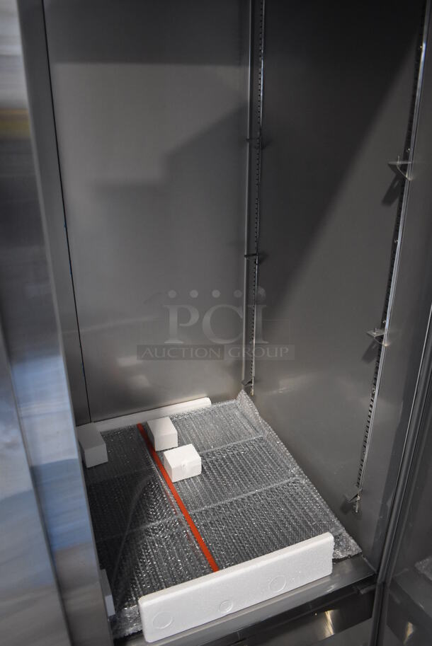 BRAND NEW SCRATCH AND DENT! KoolMore RIR-2D-SS Stainless Steel Commercial 2 Door Reach In Cooler w/ Poly Coated Racks on Commercial Casters. 115 Volts, 1 Phase. 54x32.5x83. Tested and Working! - Image 6 of 8