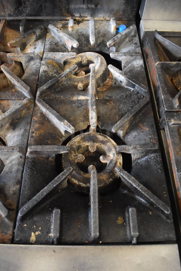 Garland SunFire Stainless Steel Commercial Natural Gas Powered 10 Burner Range w/ 2 Ovens, Over Shelf and Back Splash on Commercial Casters.  - Image 6 of 8