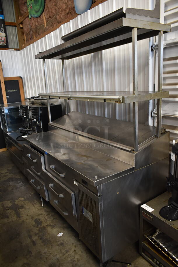 Randell Stainless Steel Commercial Pizza Prep Table w/ 6 Drawers and 2 Tier Over Shelf on Commercial Casters. Tested and Powers On But Does Not Get Cold