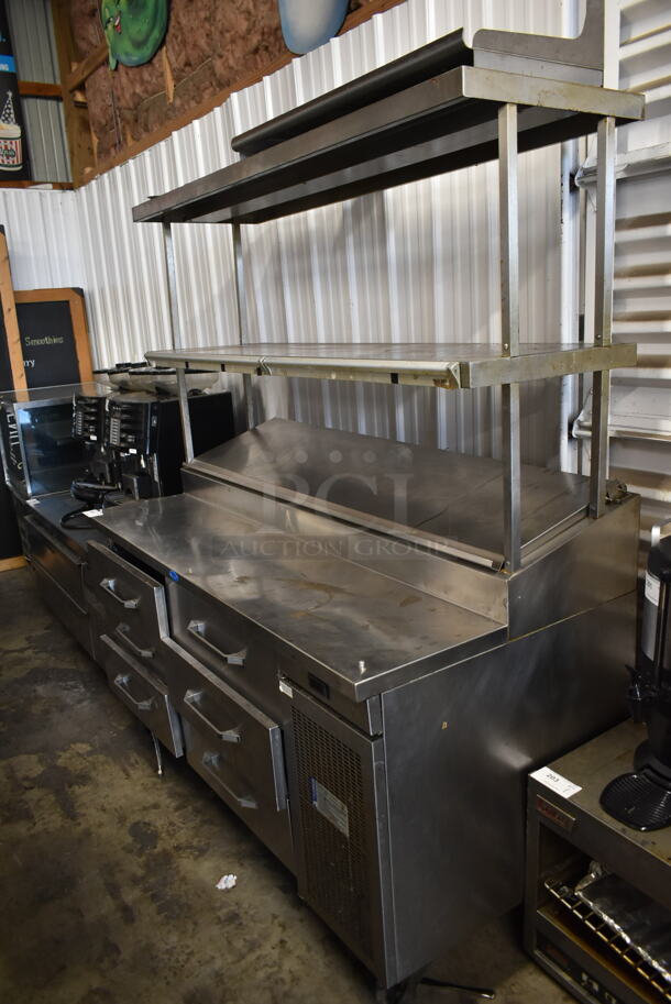 Randell Stainless Steel Commercial Pizza Prep Table w/ 6 Drawers and 2 Tier Over Shelf on Commercial Casters. Tested and Powers On But Does Not Get Cold - Image 1 of 7