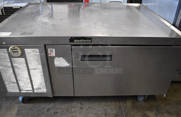 Delfield Stainless Steel Commercial Single Door Chef Base on Commercial Casters. 47.5x35x24. Tested and Powers On But Does Not Get Cold