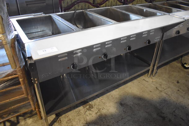 ServIt 423EST4WE750 Stainless Steel Commercial Electric Powered 4 Bay Electric Powered Steam Table w/ Cutting Board and Under Shelf. 208/240 Volts. 58x30x33