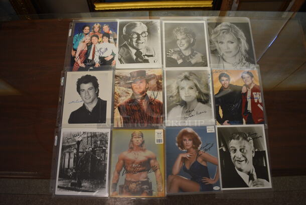 12 Autographed Headshots Including Three's Company Cast, Bette Midler, John Travolta, Gene Kelly, and Arnold Schwarzenegger. 12 Times Your Bid! - Image 1 of 8