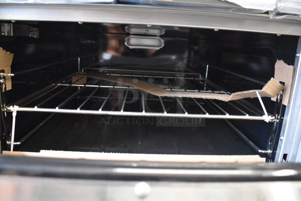 BRAND NEW SCRATCH AND DENT! Garland G60-6G24RR Stainless Steel Commercial Natural Gas Powered 6 Burner Range w/ Right Side Flat Top Griddle, 2 Ovens, Over Shelf and Back Splash. Missing 1 Leg and 1 Leg Is Bent. 310,000 BTU. 59x34x59. Tested and Working! - Image 8 of 11