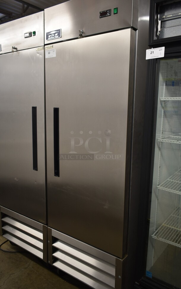 Arctic Air AF23 Stainless Steel Commercial Single Door Reach In Freezer w/ Poly Coated Racks on Commercial Casters. 115 Volts, 1 Phase. Tested and Working!