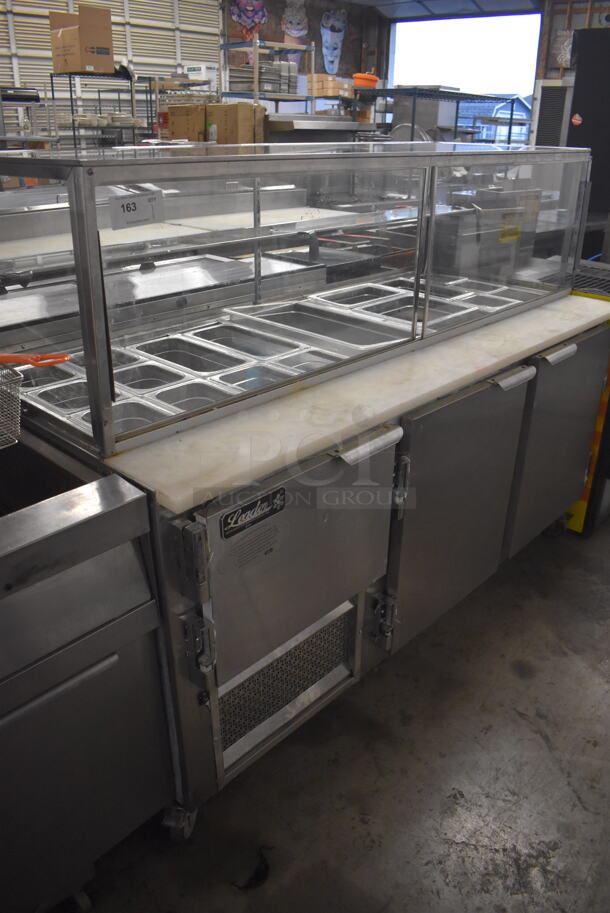 Leader Stainless Steel Commercial Prep Table w/ Glass Sneeze Guard, Various Drop In Bins on Commercial Casters. 115 Volts, 1 Phase. 72x33x55. Tested and Does Not Power On - Image 1 of 9