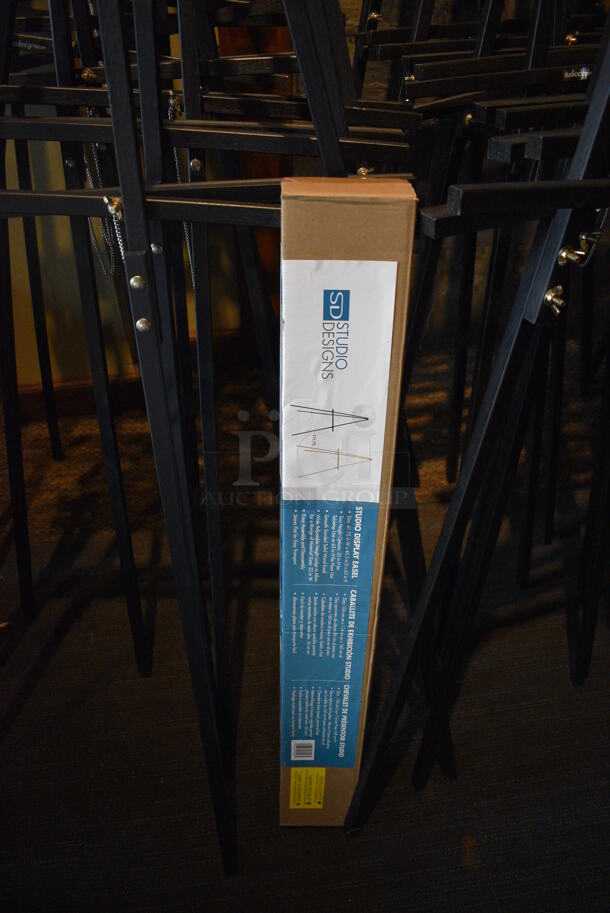 8 Black Easels. 1 BRAND NEW IN BOX. BUYER MUST REMOVE. 22x36x64. 8 Times Your Bid! (Susquehanna Ale House) - Image 4 of 4