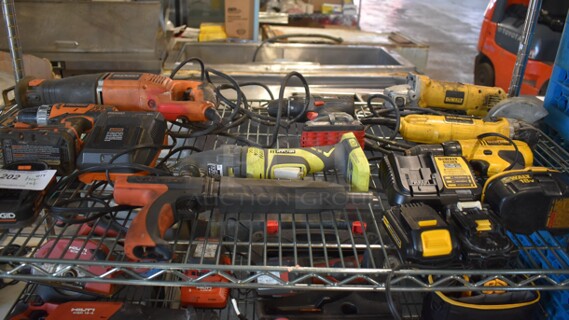 ALL ONE MONEY! Tier Lot of Various Tools Including Rigid R3001 Saw, Rigid R860052 Drill, Rigid Battery Charger, Ramset MasterShot Fastener, Ryobi P246 Series D Multi Tool, DeWalt DW9099 Drill, DeWalt Battery and Charger, DeWalt DWE4011 Angle Grinder, DeWalt D28402 Angle Grinder.