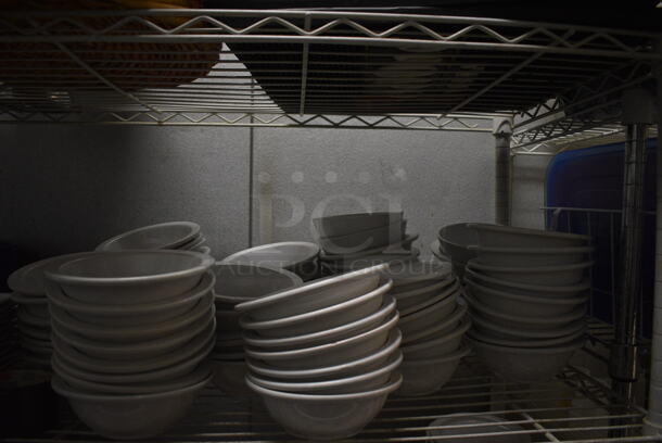 White Finish 5 Tier Shelving Unit w/ Contents Including White Ceramic Dishes, Baskets, Utensils. 48x18x74. BUYER MUST REMOVE. BUYER MUST DISMANTLE. PCI CANNOT DISMANTLE FOR SHIPPING. PLEASE CONSIDER FREIGHT CHARGES. (kitchen) - Image 3 of 11