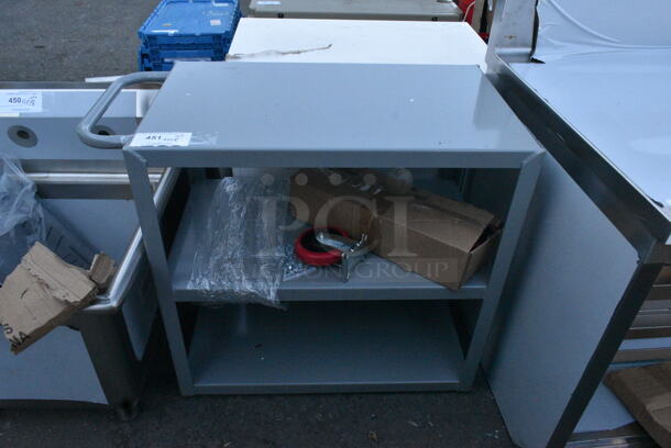 BRAND NEW SCRATCH AND DENT! Lavex Gray Metal 3 Tier Cart w/ Commercial Casters.  - Image 1 of 7
