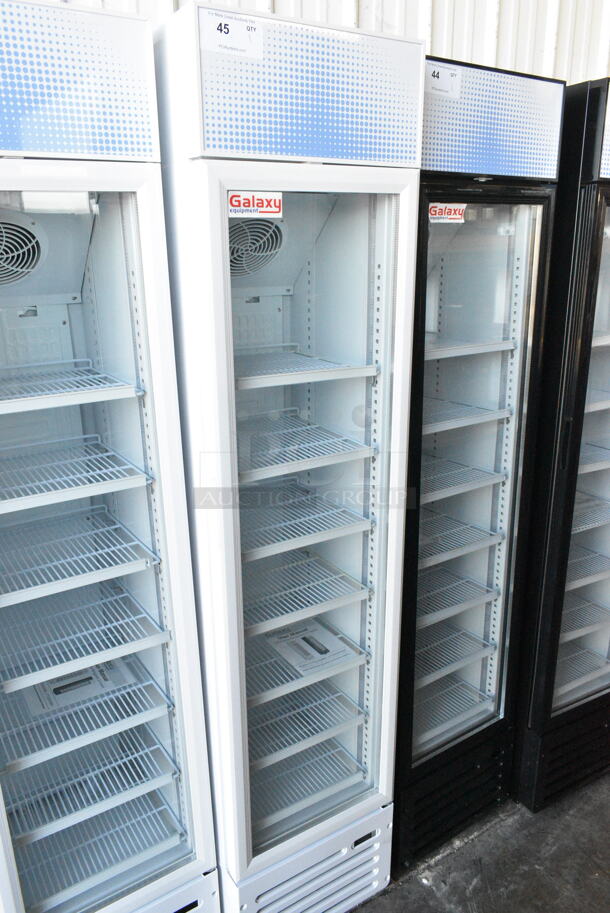 BRAND NEW SCRATCH AND DENT! Galaxy 177GDN5RBW Metal Commercial Single Door Reach In Cooler Merchandiser w/ Poly Coated Racks and Red, White, and Blue LED Lighting. 110-120 Volts, 1 Phase. Tested and Working! - Image 1 of 6