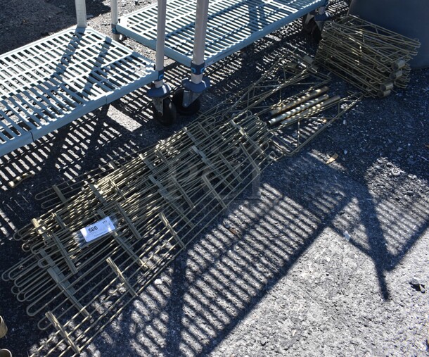 ALL ONE MONEY! Lot of Tan Pieces for Wire Shelves Including Bumpers and Brackets - Image 1 of 5