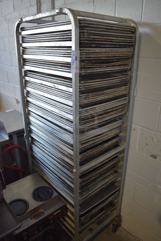 Metal Commercial Pan Transport Rack on Commercial Casters w/ 2 Metal Half Size Baking Pans and 72 Full Sizes Baking Pans. 20.5x26x69, 13x18x1, 18x26x1