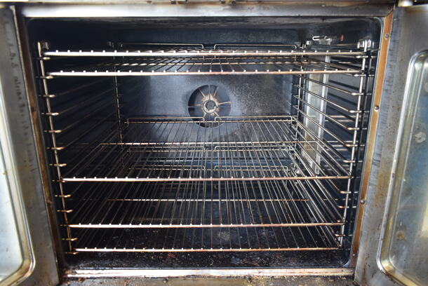 2020 Duke E101-GV Stainless Steel Commercial Gas Powered Full Size Convection Oven w/ View Through Doors, Metal Oven Racks and Thermostatic Controls on Metal Legs. - Image 5 of 8