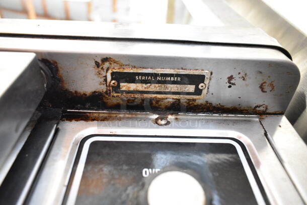 Blodgett Stainless Steel Commercial Natural Gas Powered Half Size Convection Oven w/ View Through Door, Metal Oven Racks, Thermostatic Controls and Equipment Stand on Commercial Casters. Missing 1 Caster. - Image 9 of 11