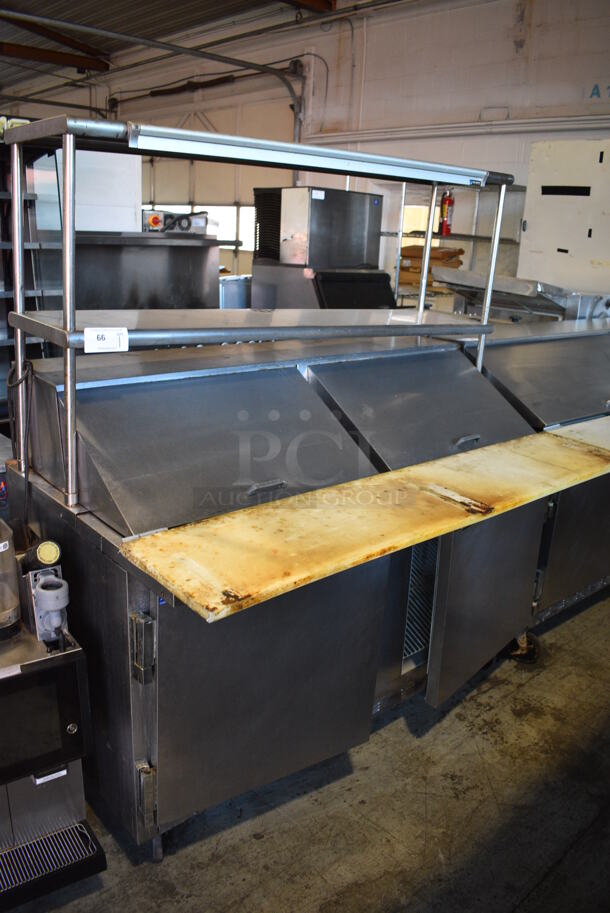 Beverage Air Model SP60-24M Stainless Steel Commercial Sandwich Salad Prep Table Bain Marie Mega Top w/ 13 Various Drop In Bins and 2 Over Shelves on Commercial Casters. 115 Volts, 1 Phase. 60x36x69. Tested and Powers On But Does Not Get Cold