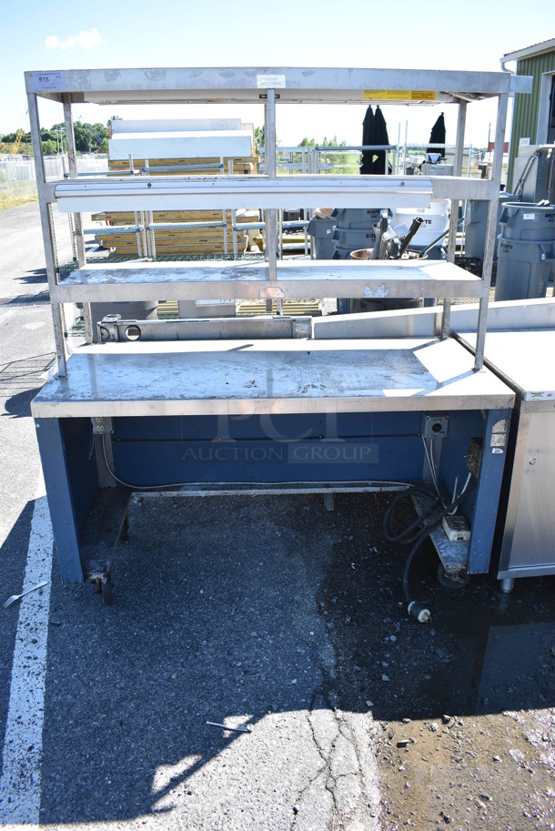 Stainless Steel Table w/ 3 Over Shelves, Warming Strip and Check Order Holding Rod on Commercial Casters. 62x29x73