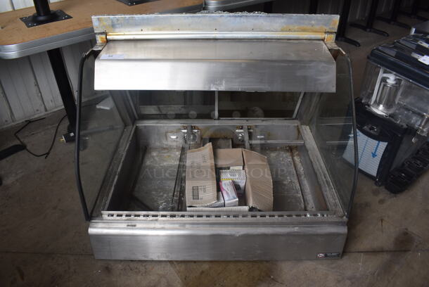 Henny Penny HMT-3 Electric Countertop Heated Merchandising Case. Front Glass Is Missing. Includes Bulbs. 208-240 Volt