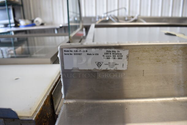 Duke Model SUB-P-36M Stainless Steel Commercial Counter w/ 2 Wood Pattern Doors and Backsplash. 36x30x40 - Image 5 of 6