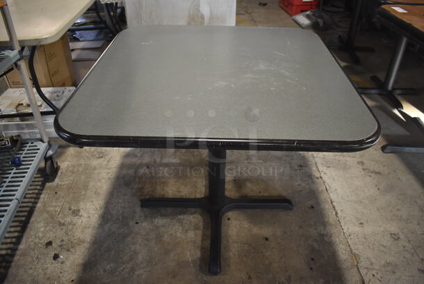 Gray Table on Black Metal Table Base. 36x36x30