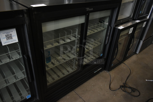 2024 True GDM-41SL-48-HC-LD Metal Commercial 2 Door Reach In Cooler Merchandiser w/ Poly Coated Racks. 115 Volts, 1 Phase. Tested and Working!