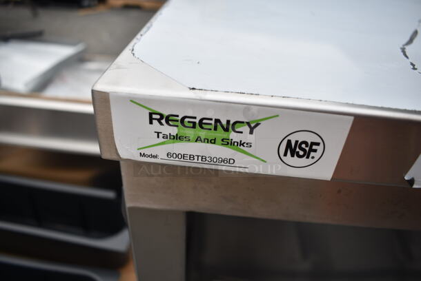 BRAND NEW SCRATCH AND DENT! Regency 600EBTB3096D 30" x 96" 16 Gauge Type 304 Stainless Steel Enclosed Base Sliding Door Table with Adjustable Midshelf and 6" Backsplash - Image 8 of 8