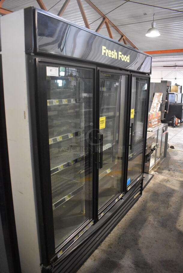 True GDM-72 Commercial Reach In Floor Style Triple Swing Glass Door Merchandiser Cooler In Black With Polycoated Racks. 115V/ 1 Phase Tested And Working - Image 2 of 7
