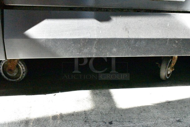 Garland M45R Stainless Steel Commercial Natural Gas Powered Flat Top w/ Oven, Over Shelf and Back Splash on Commercial Casters.  - Image 5 of 8